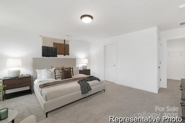 a bedroom with a bed and a television