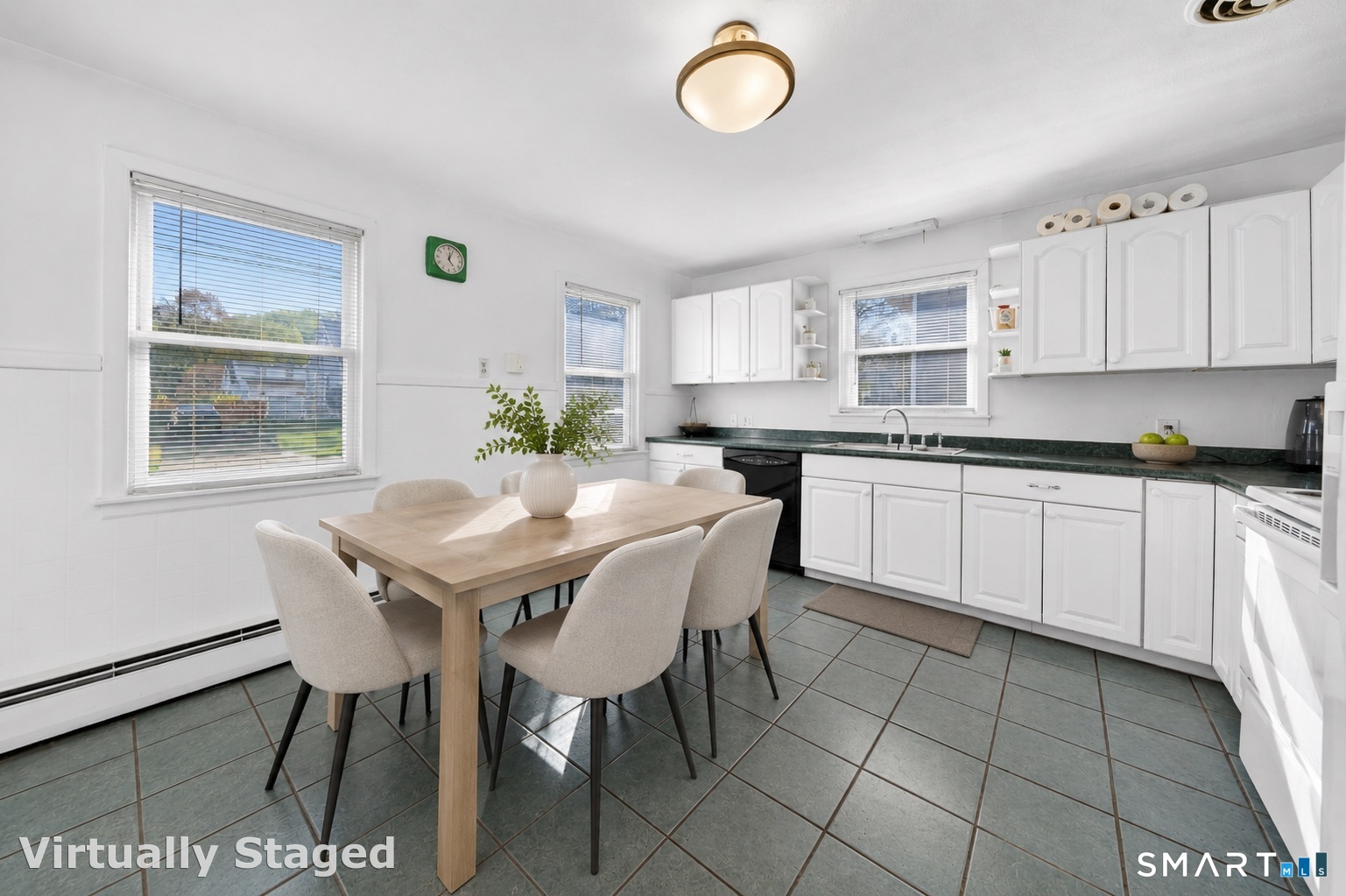 30 Grafton Road Hamden, CT 06517 - Photo 7 of 23 a kitchen with stainless steel appliances granite countertop a sink a stove a dining table and chairs