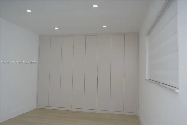 a view of a livingroom with wooden floor