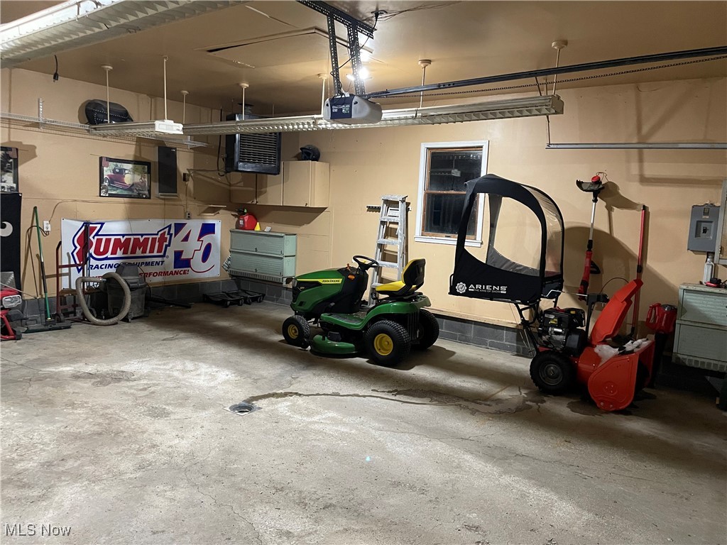 1381 Robb Road Conneaut, OH 44030 - Photo 36 of 50 Attached Garage with a heating unit and a garage door opener