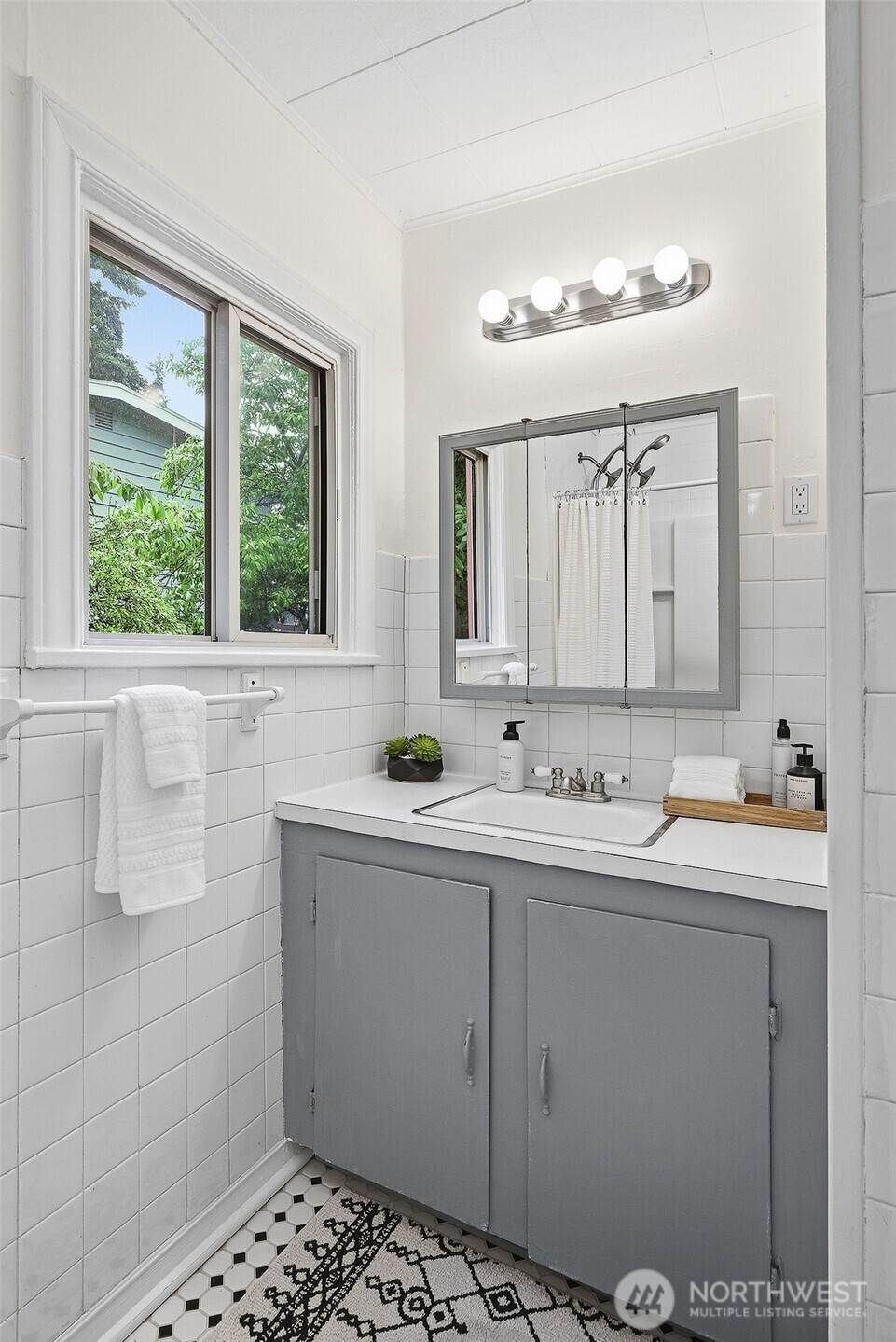 17633 10th Avenue Northeast Shoreline, WA 98155 - Photo 19 of 33 a bathroom with a sink and a mirror