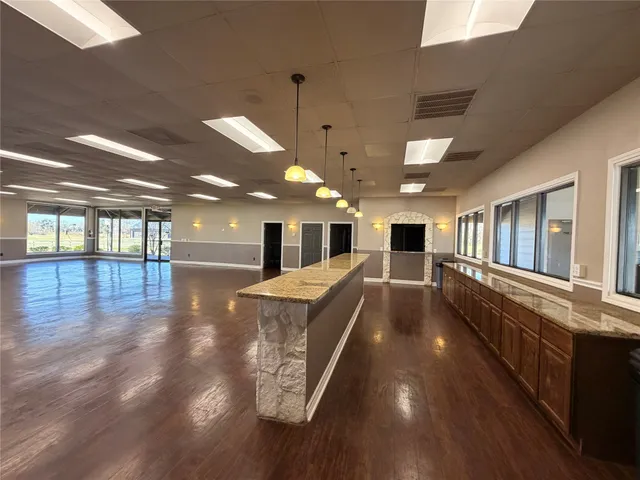 a view of a swimming pool with a lounge chair