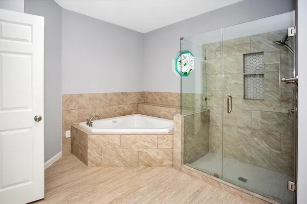 a bathroom with a sink and shower