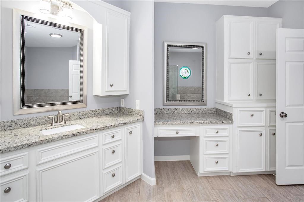 24600 Nine Bar Road Hempstead, TX 77445 - Photo 17 of 26 a bathroom with a granite countertop sink and mirror