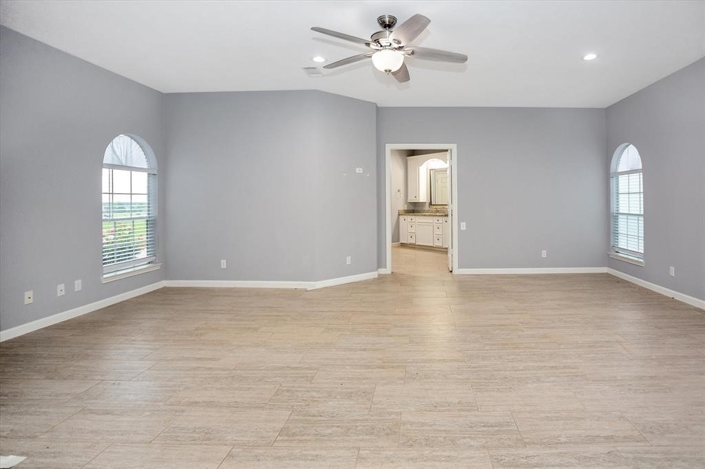 24600 Nine Bar Road Hempstead, TX 77445 - Photo 19 of 26 wooden floor in an empty room with a window