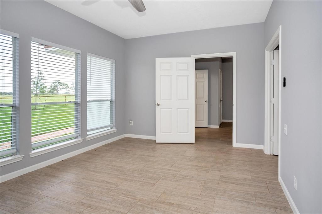 24600 Nine Bar Road Hempstead, TX 77445 - Photo 22 of 26 a view of an empty room with a window
