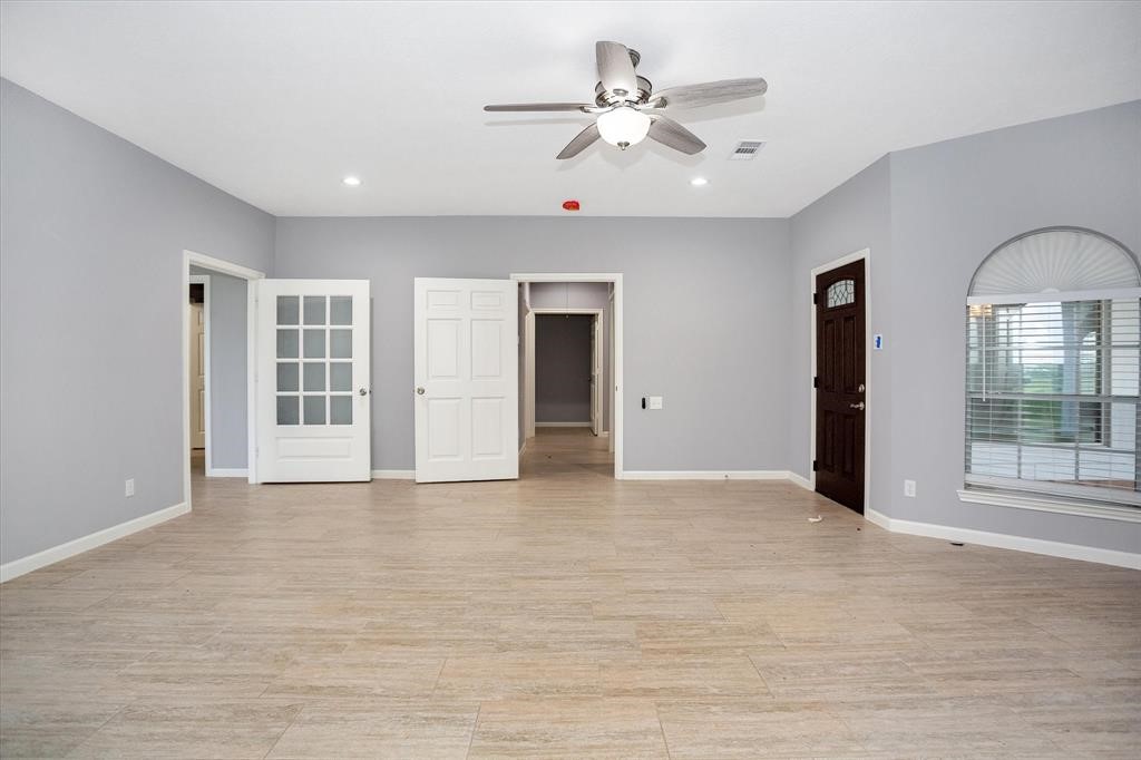 24600 Nine Bar Road Hempstead, TX 77445 - Photo 6 of 26 a view of an empty room with a window