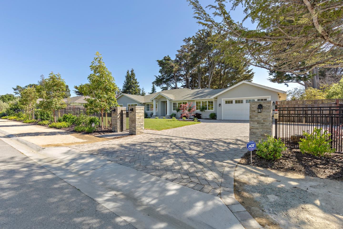355 Darrell Road Hillsborough, CA 94010 - Photo 2 of 50 a front view of a house with a yard and a garage