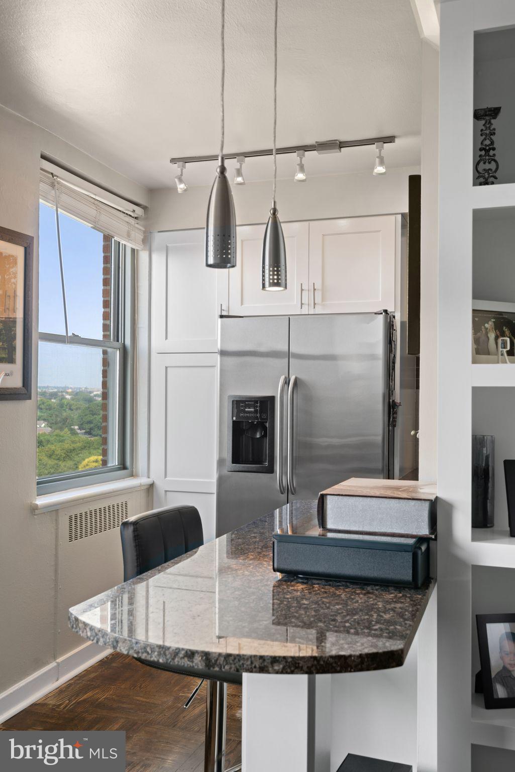 2601 Pennsylvania Avenue, Unit 846 Philadelphia, PA 19130 - Photo 12 of 40 a bathroom with a granite countertop sink and a mirror