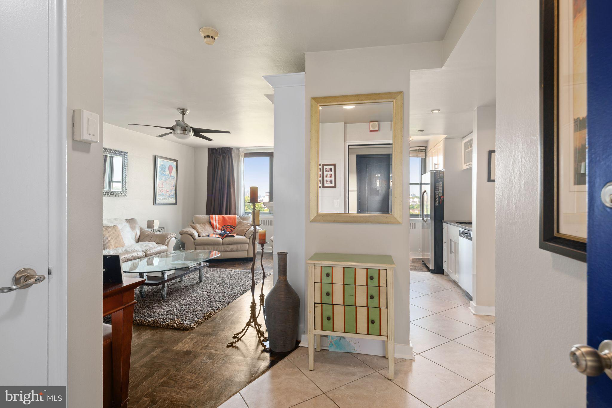 2601 Pennsylvania Avenue, Unit 846 Philadelphia, PA 19130 - Photo 2 of 40 a living room with furniture and a fireplace