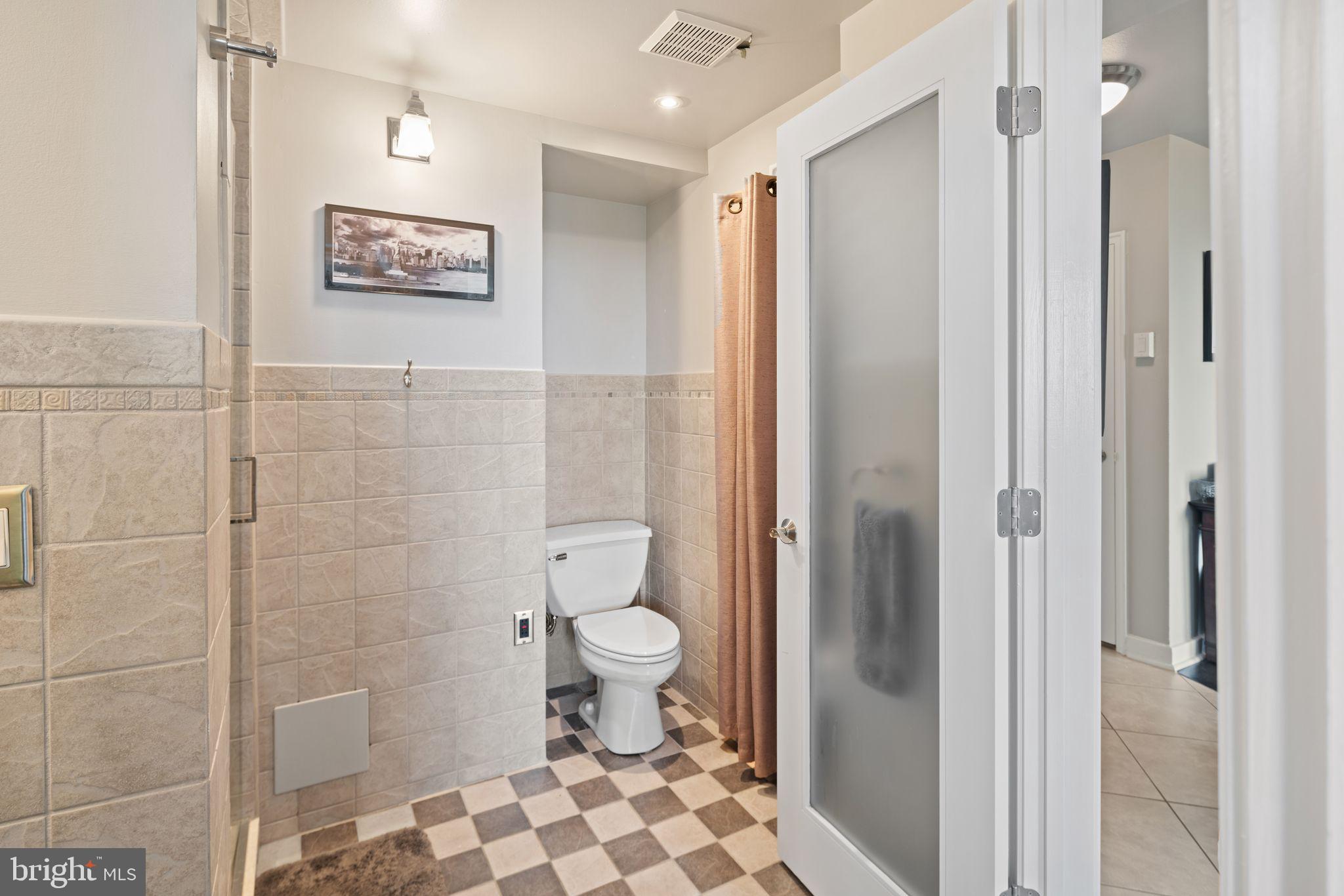 2601 Pennsylvania Avenue, Unit 846 Philadelphia, PA 19130 - Photo 24 of 40 a bathroom with a toilet and a shower