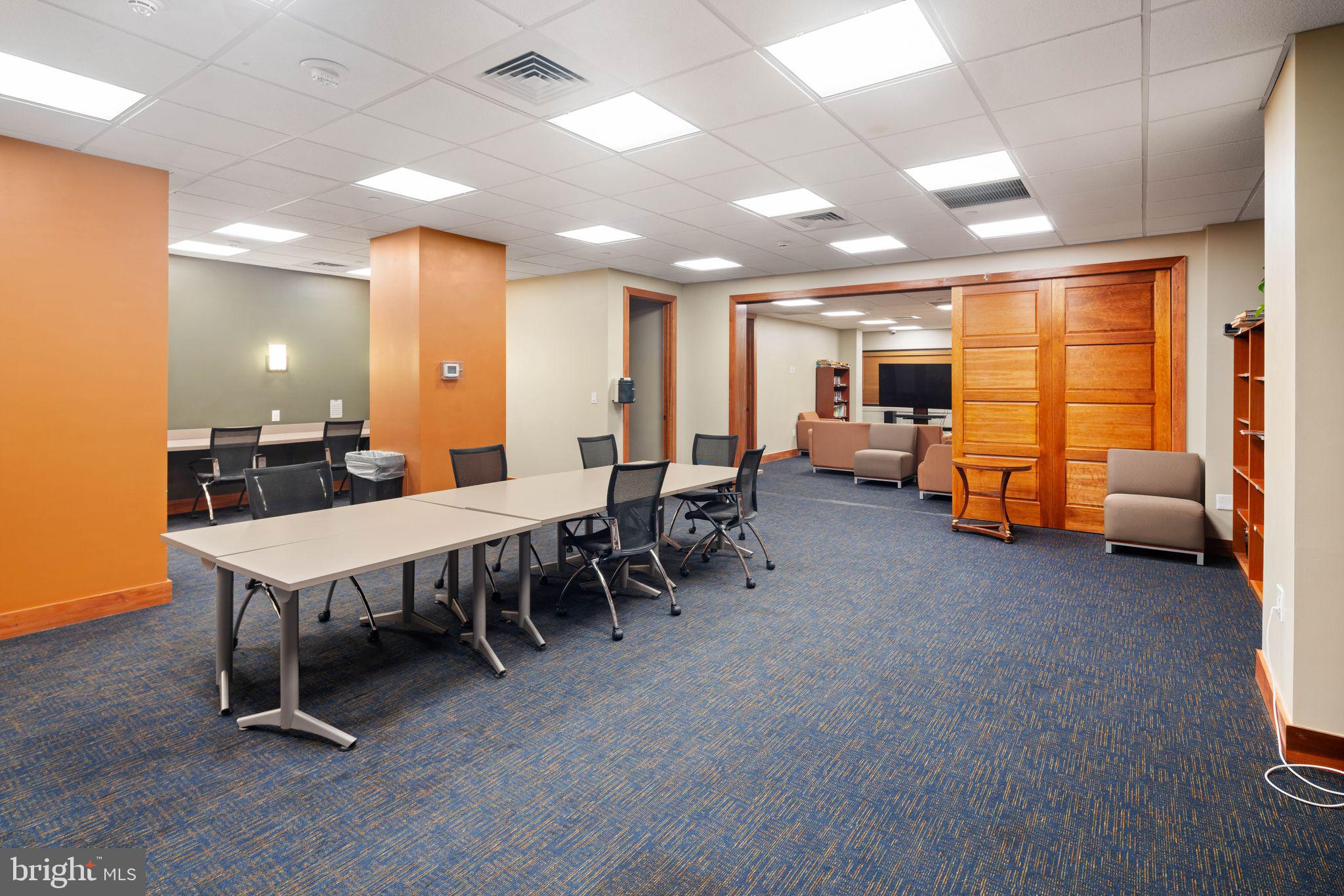 2601 Pennsylvania Avenue, Unit 846 Philadelphia, PA 19130 - Photo 30 of 40 a large room with chairs a table and chairs in it