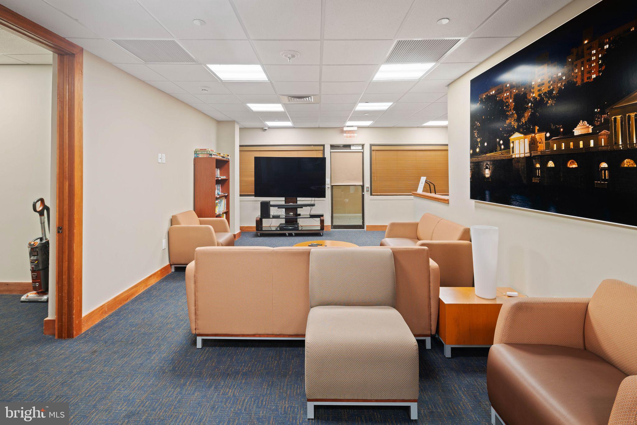 2601 Pennsylvania Avenue, Unit 846 Philadelphia, PA 19130 - Photo 31 of 40 a living room with furniture and a flat screen tv