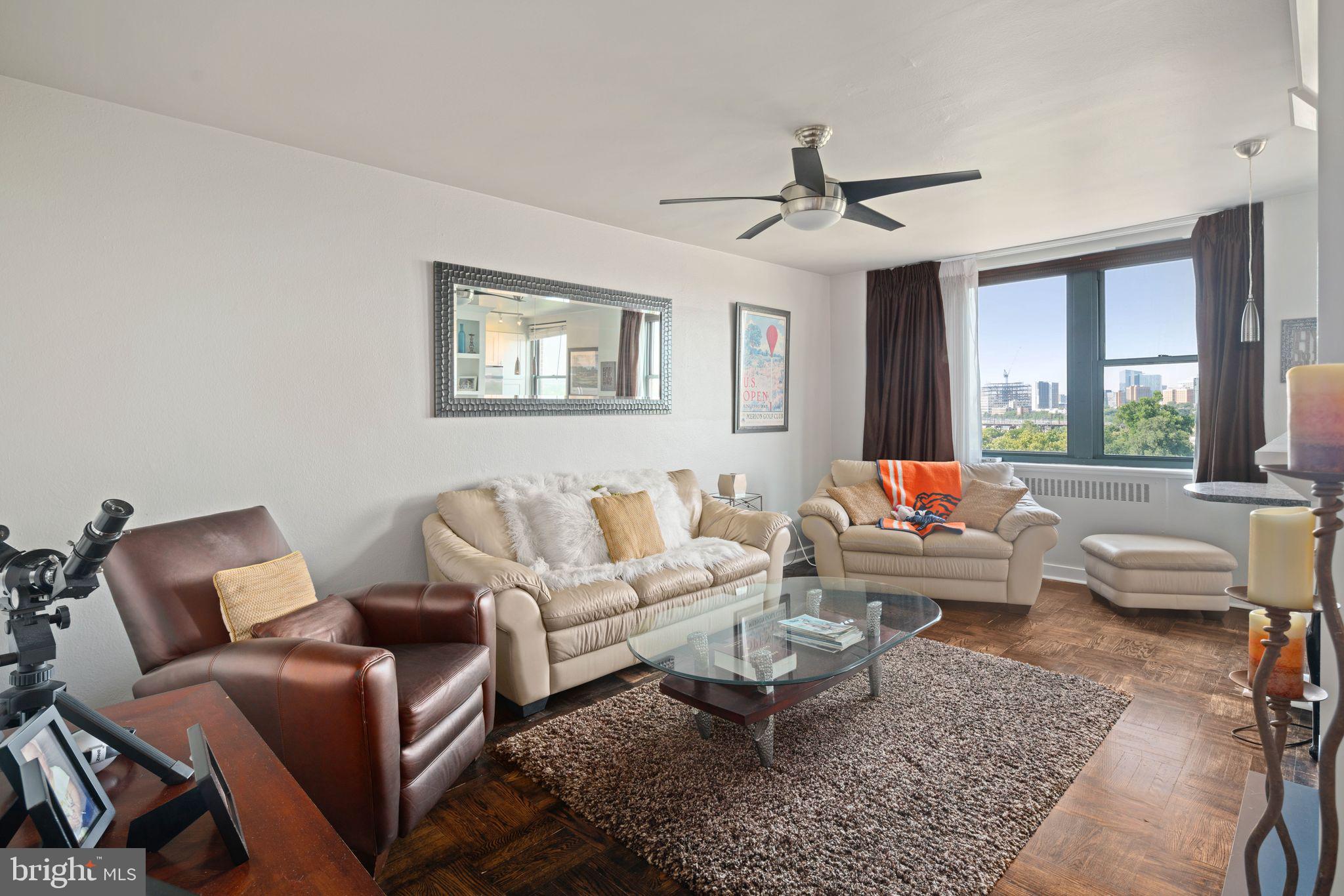 2601 Pennsylvania Avenue, Unit 846 Philadelphia, PA 19130 - Photo 5 of 40 a living room with furniture and a large window