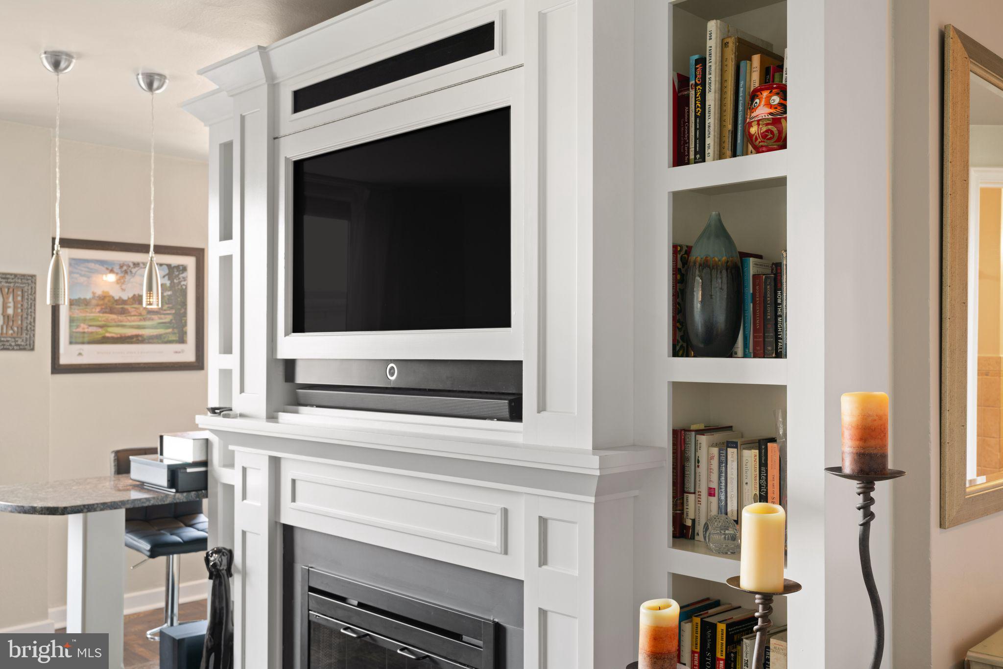 2601 Pennsylvania Avenue, Unit 846 Philadelphia, PA 19130 - Photo 7 of 40 a living room with a flat screen tv and a fireplace