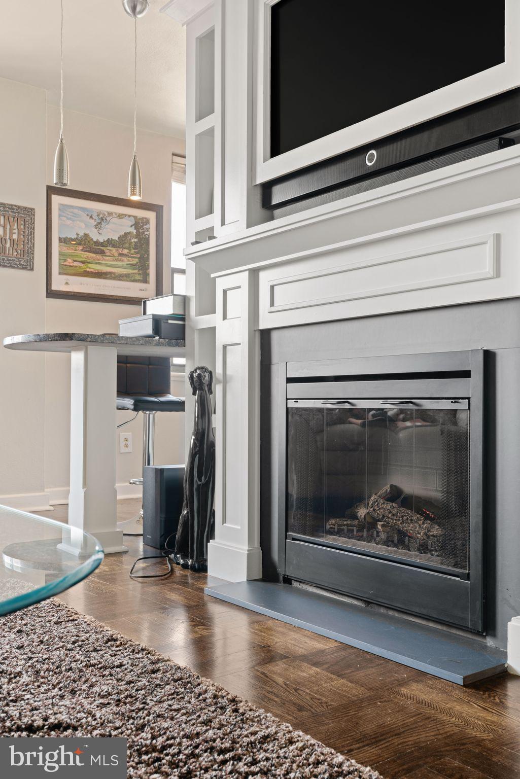 2601 Pennsylvania Avenue, Unit 846 Philadelphia, PA 19130 - Photo 8 of 40 a living room with furniture and a fireplace