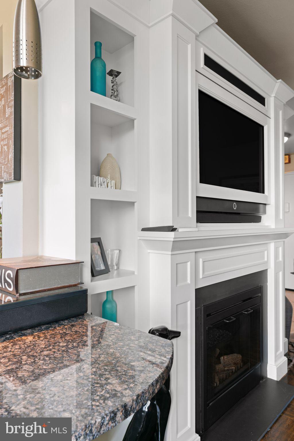 2601 Pennsylvania Avenue, Unit 846 Philadelphia, PA 19130 - Photo 10 of 40 a kitchen with a stove and a fireplace