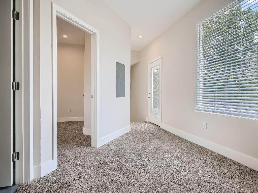 6919 Bethune Avenue, Unit B Austin, TX 78752 - Photo 13 of 17 a view of an empty room with closet and a window