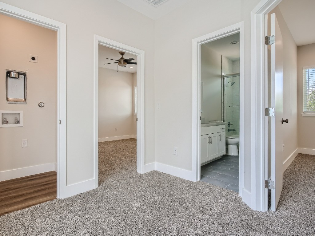 6919 Bethune Avenue, Unit B Austin, TX 78752 - Photo 14 of 17 a view of a hallway with closet and a bathroom