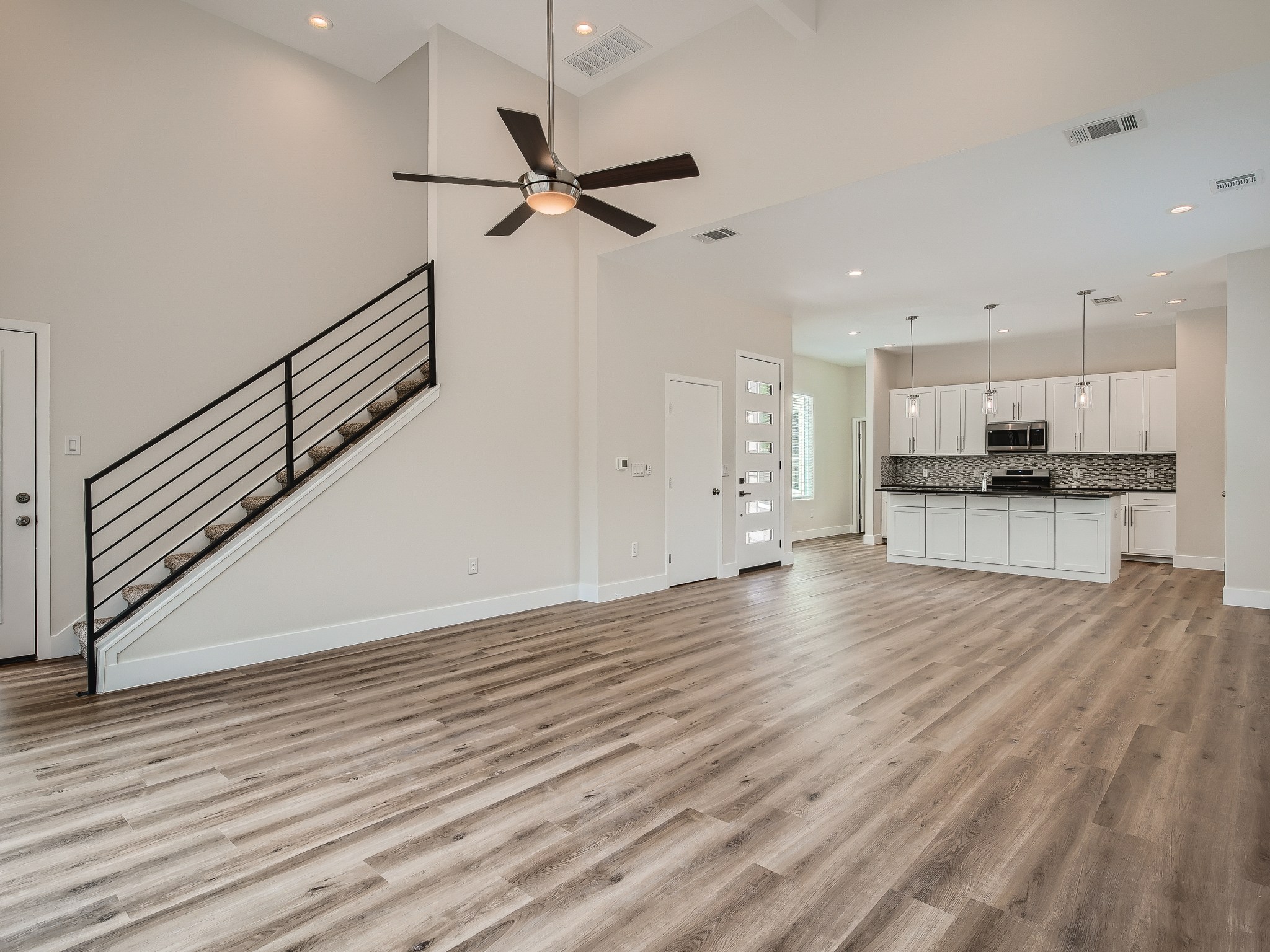 6919 Bethune Avenue, Unit B Austin, TX 78752 - Photo 5 of 17 a view of kitchen with wooden floor electronic appliances and window