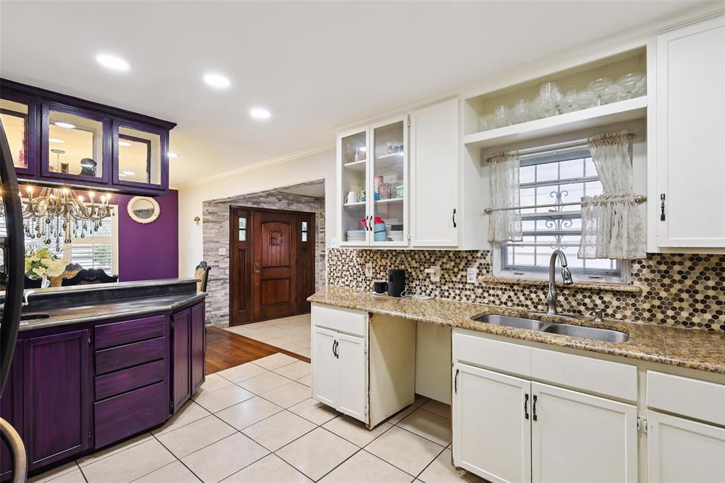 10505 Ferguson Road Dallas, TX 75228 - Photo 13 of 29 a kitchen with granite countertop a sink and cabinets