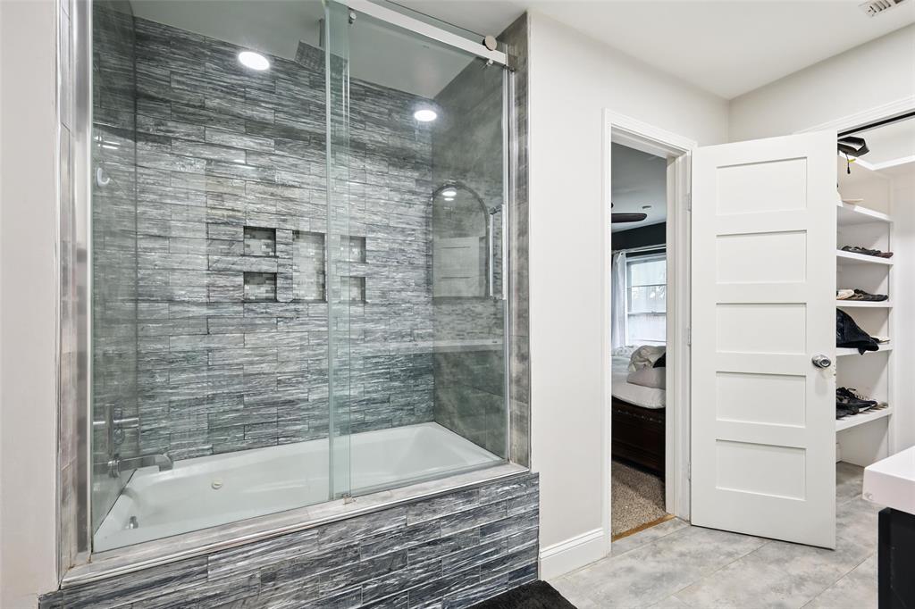 10505 Ferguson Road Dallas, TX 75228 - Photo 17 of 29 a bathroom with a shower and a sink