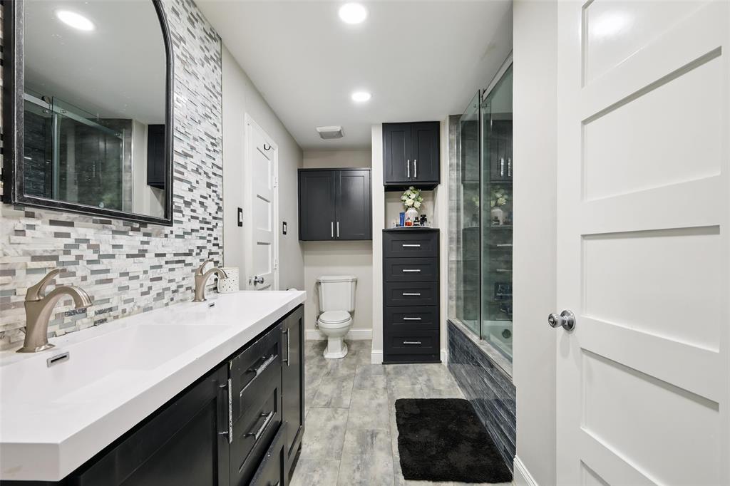 10505 Ferguson Road Dallas, TX 75228 - Photo 18 of 29 a kitchen with a sink and a refrigerator