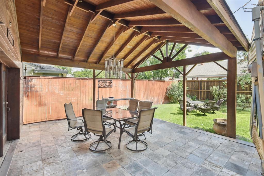 10505 Ferguson Road Dallas, TX 75228 - Photo 24 of 29 a view of an outdoor dining space with a table and chairs
