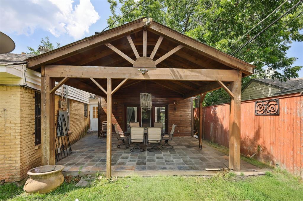 10505 Ferguson Road Dallas, TX 75228 - Photo 26 of 29 a front view of a house with garden