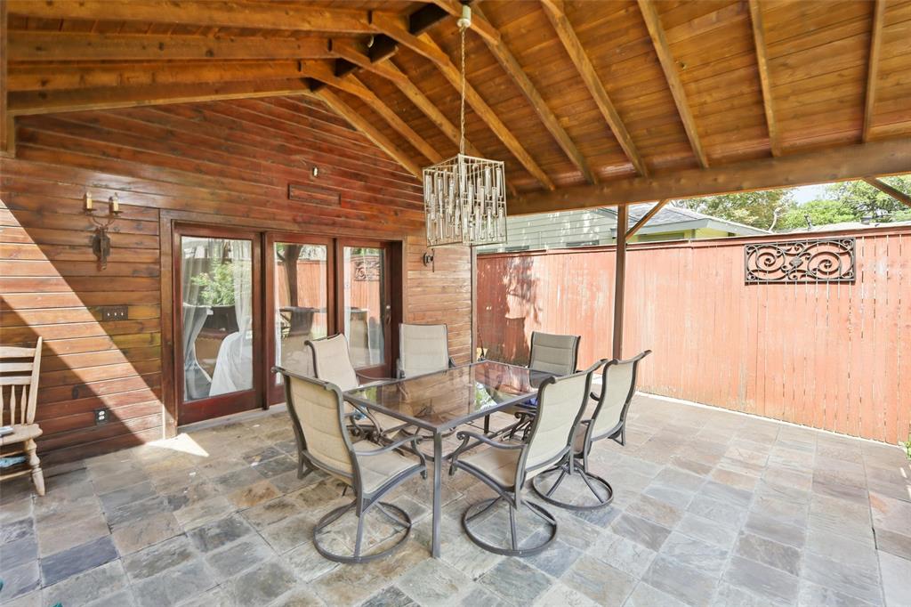 10505 Ferguson Road Dallas, TX 75228 - Photo 27 of 29 a dining room with furniture and a floor to ceiling window
