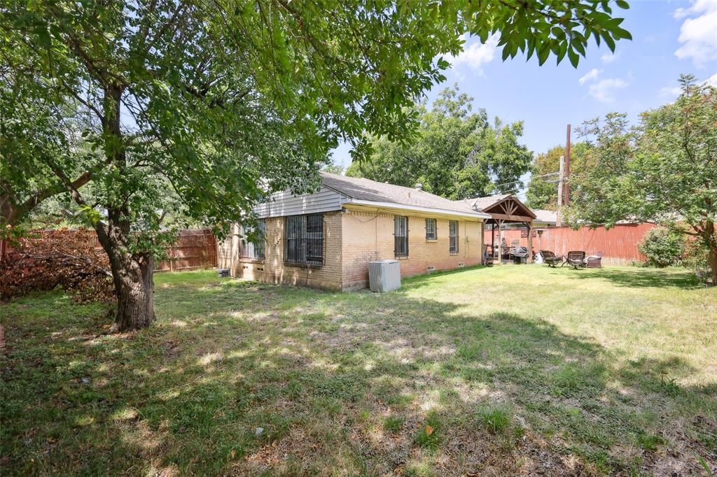 10505 Ferguson Road Dallas, TX 75228 - Photo 28 of 29 a view of a house with a yard