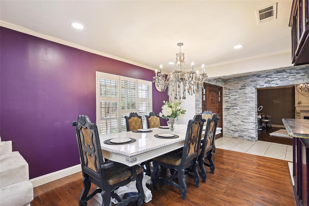 10505 Ferguson Road Dallas, TX 75228 - Photo 10 of 29 a view of a dining room with furniture window and wooden floor