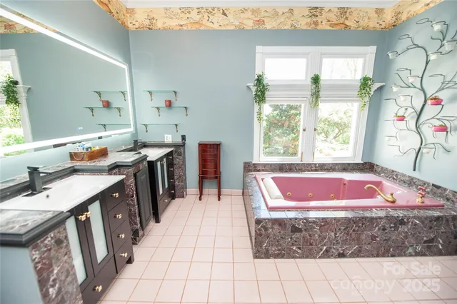 a bath room with a sink and a window