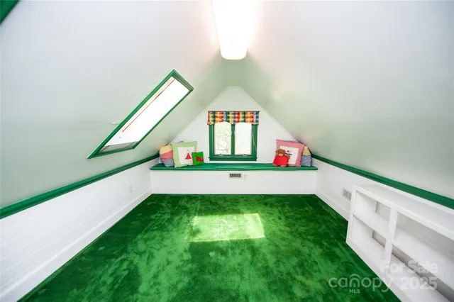 a bathroom with a toilet a sink and a window