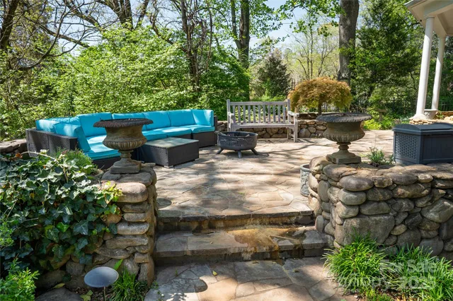 a view of backyard with sitting area