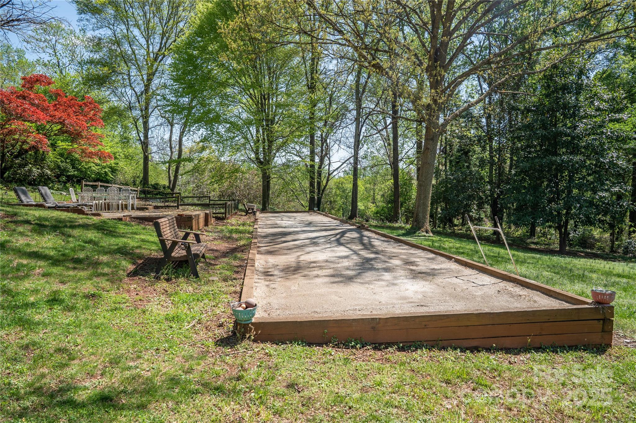 447 North Washington Street Rutherfordton, NC 28139 - Photo 44 of 48 a backyard of a house with table and chairs