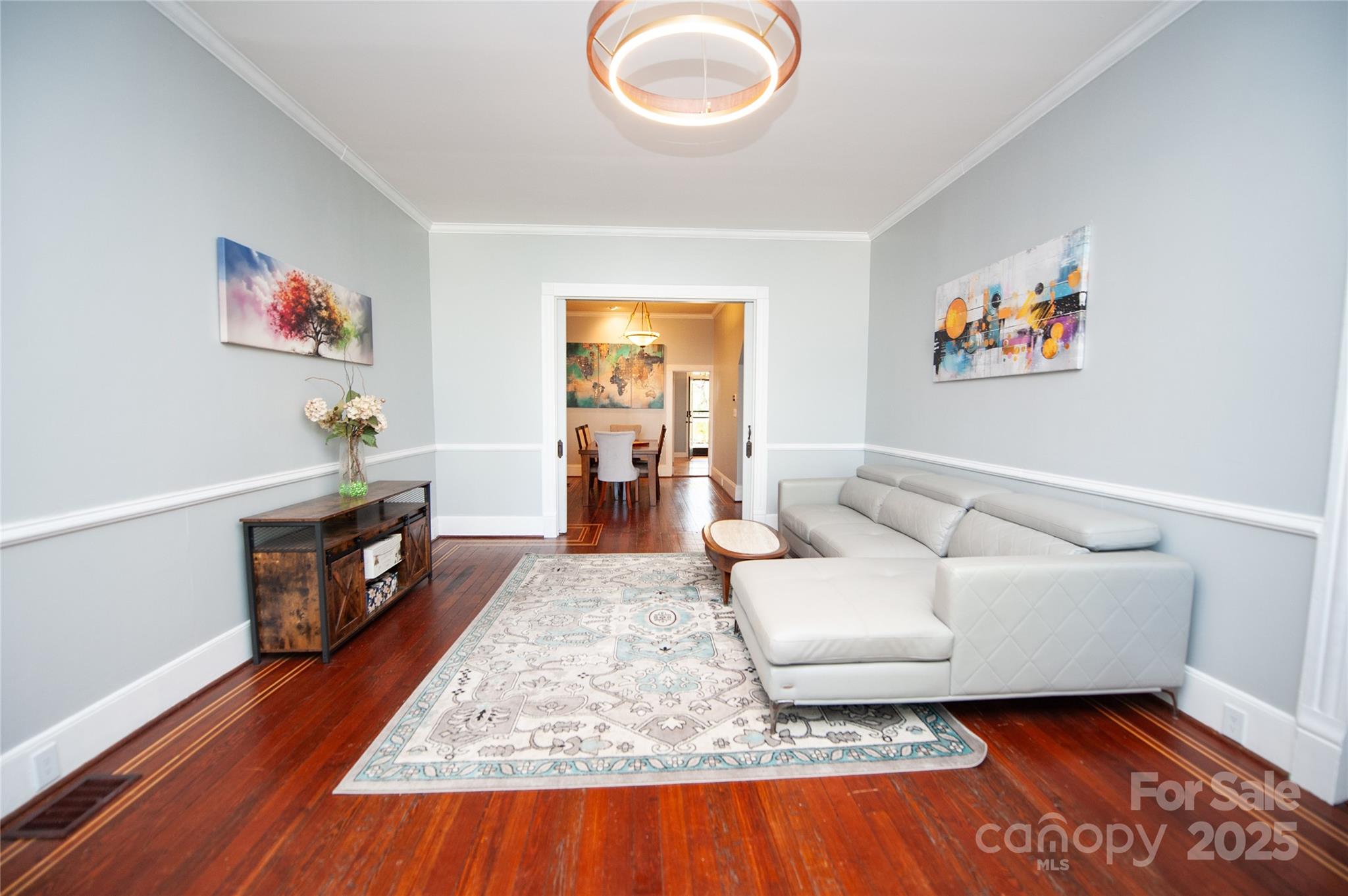 447 North Washington Street Rutherfordton, NC 28139 - Photo 8 of 48 a living room with furniture and a wooden floor