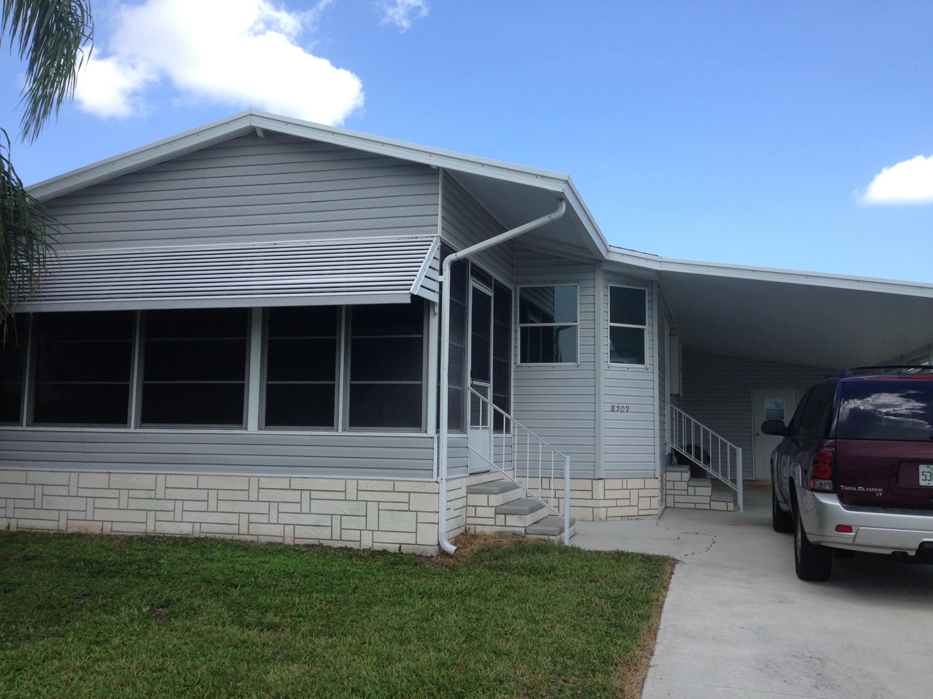 8909 Southwest Chevy Circle Stuart, FL 34997 - Photo 1 of 16 outside front
