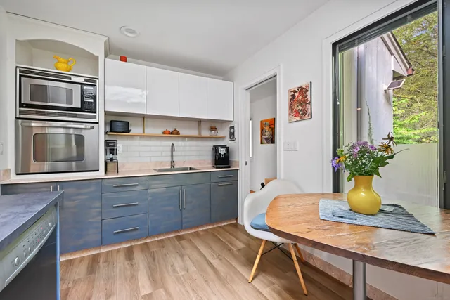 a spacious bathroom with a sink a mirror a vanity and a bathtub