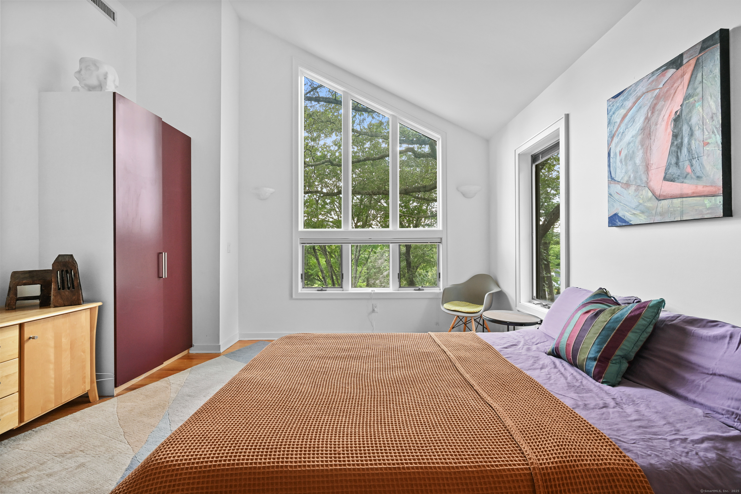 61 Marchant Road Redding, CT 06896 - Photo 25 of 38 a bed sitting in a bedroom next to a window