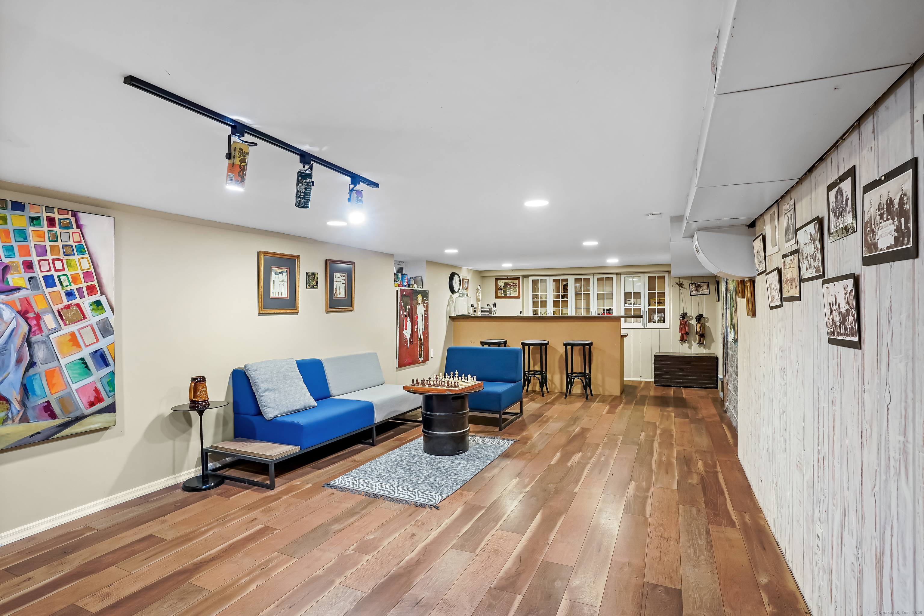 61 Marchant Road Redding, CT 06896 - Photo 29 of 38 a living room with furniture and a couch