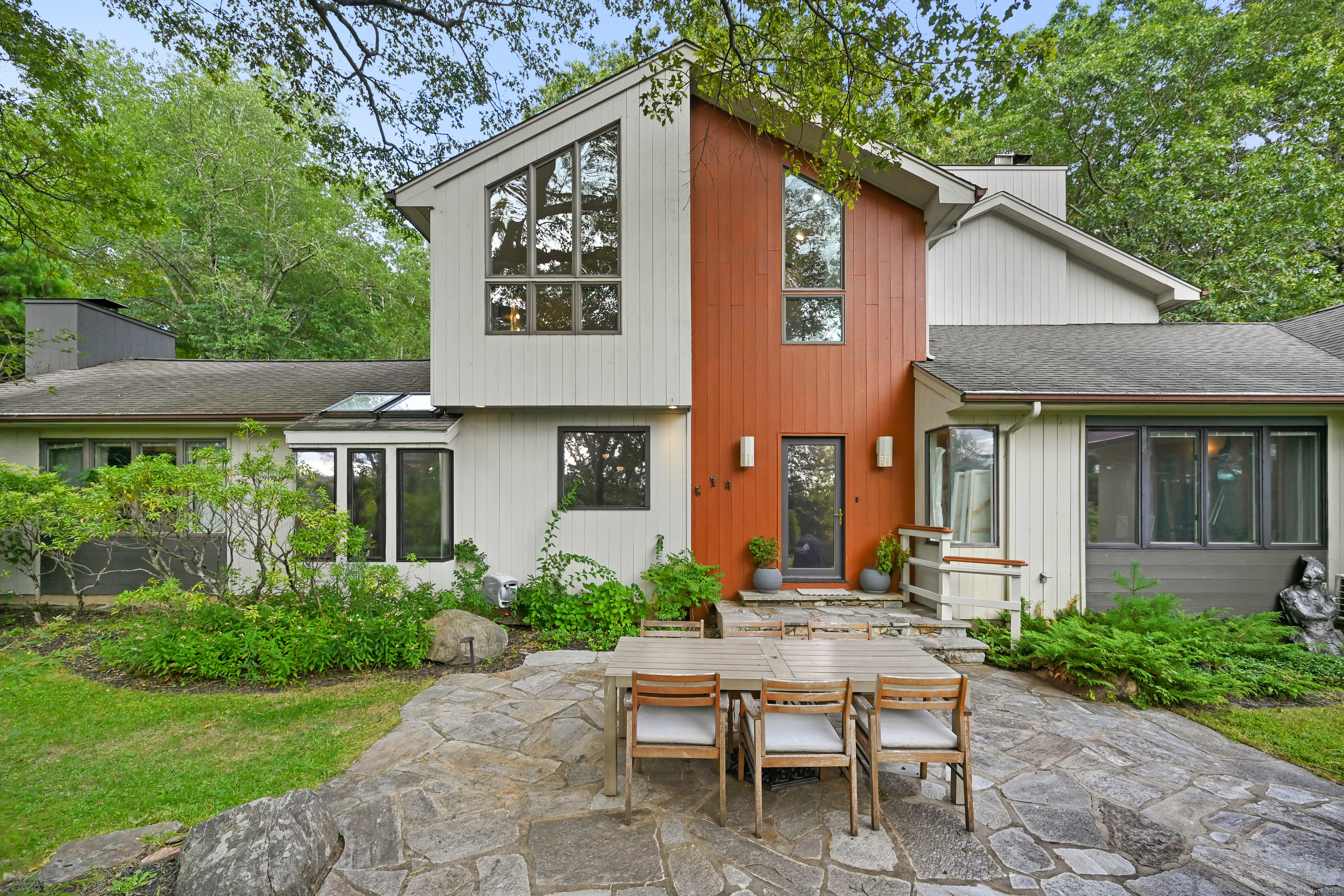 61 Marchant Road Redding, CT 06896 - Photo 31 of 38 a view of a house with backyard sitting area and garden