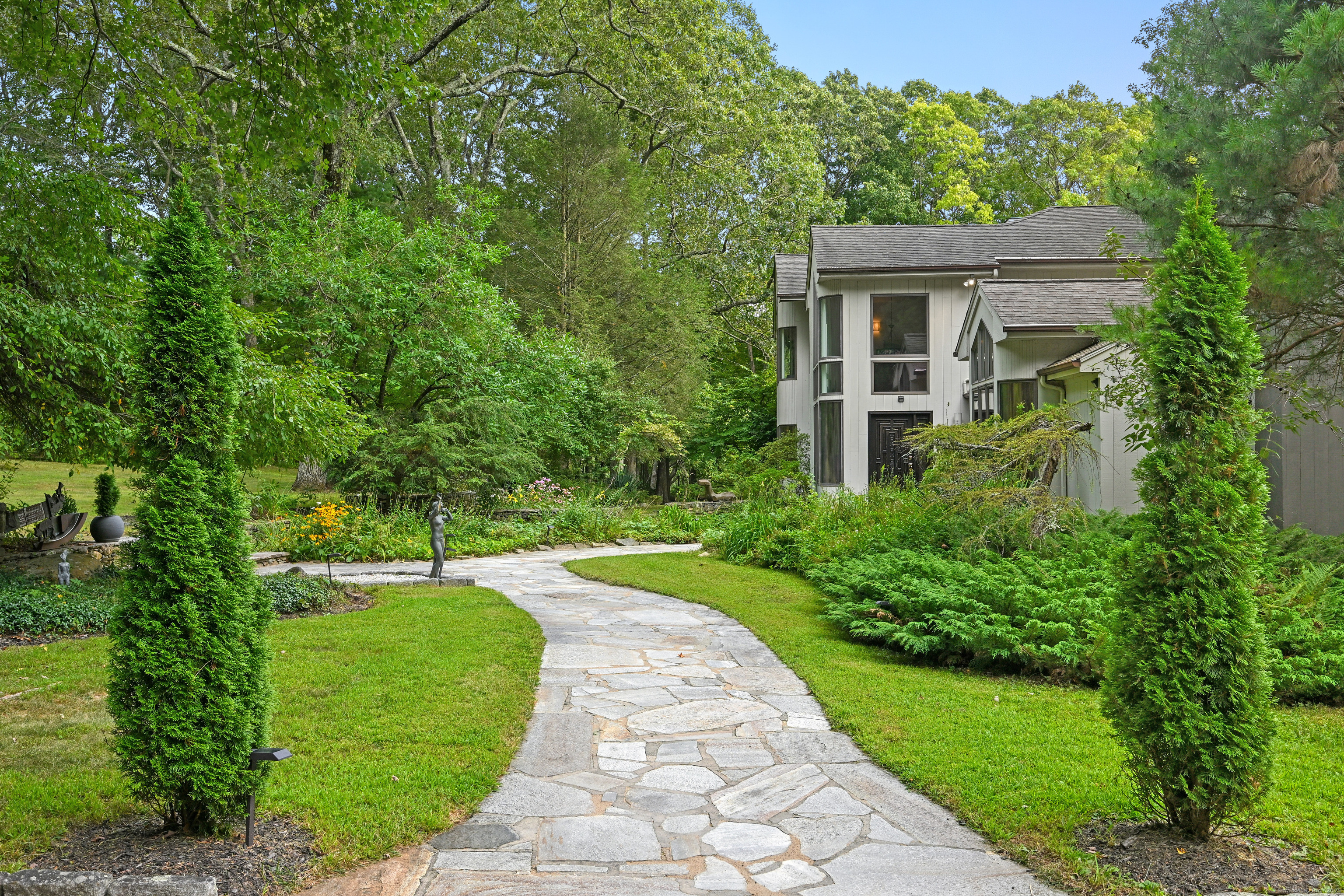61 Marchant Road Redding, CT 06896 - Photo 33 of 38 a view of a house with a backyard