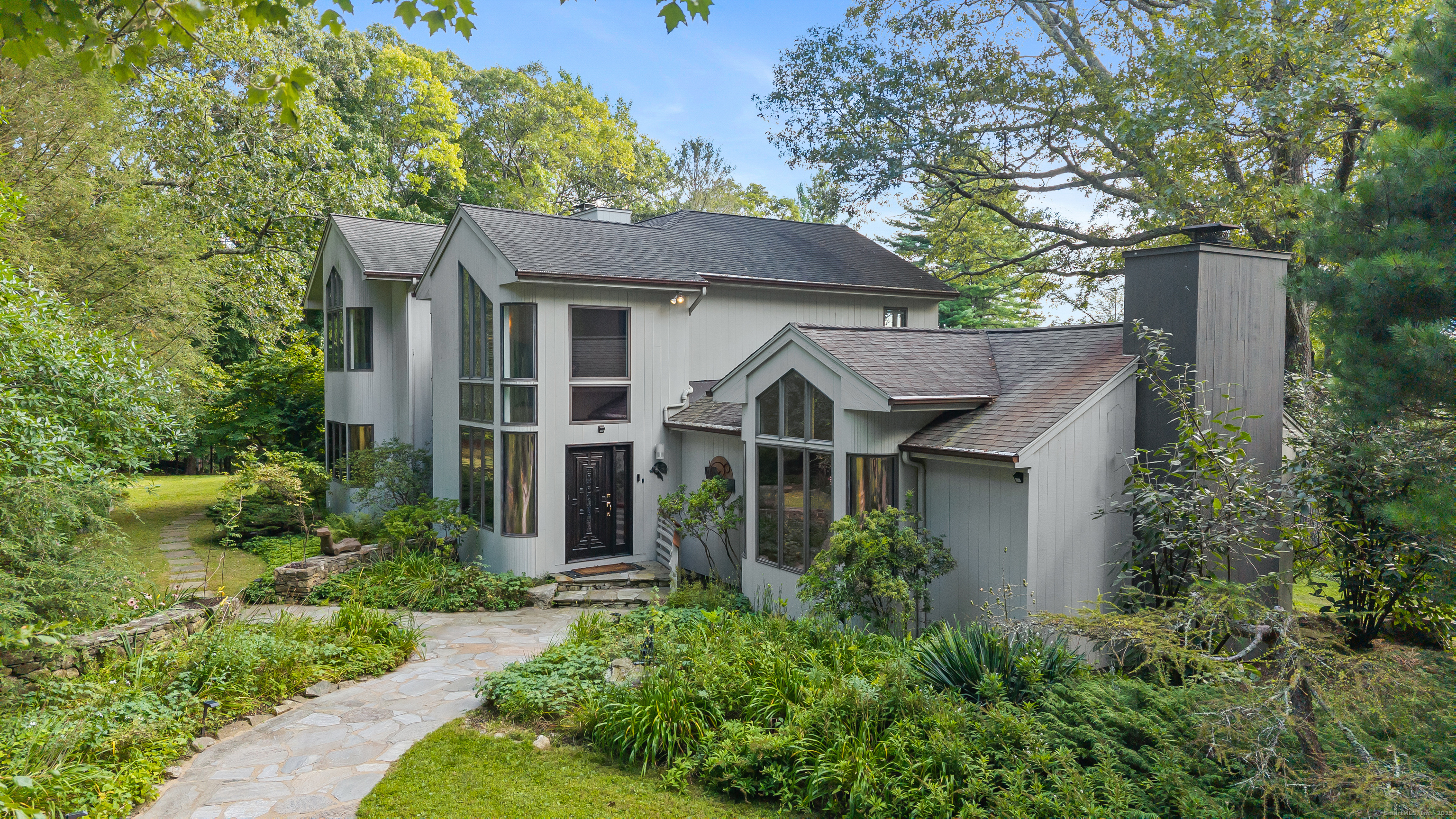 61 Marchant Road Redding, CT 06896 - Photo 35 of 38 front view of a house with a yard