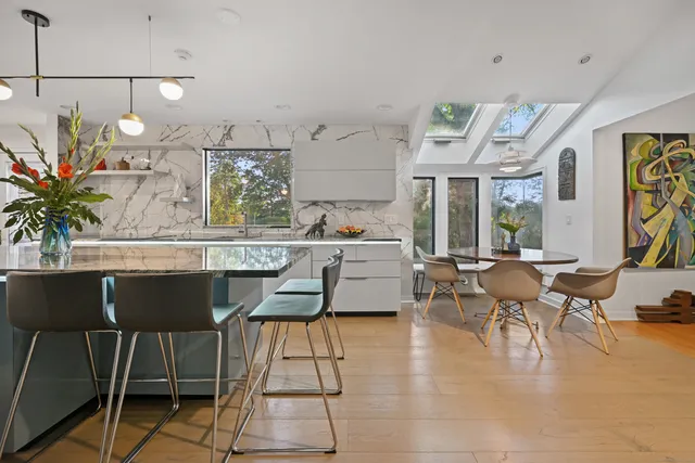 a kitchen with stainless steel appliances a refrigerator and cabinets