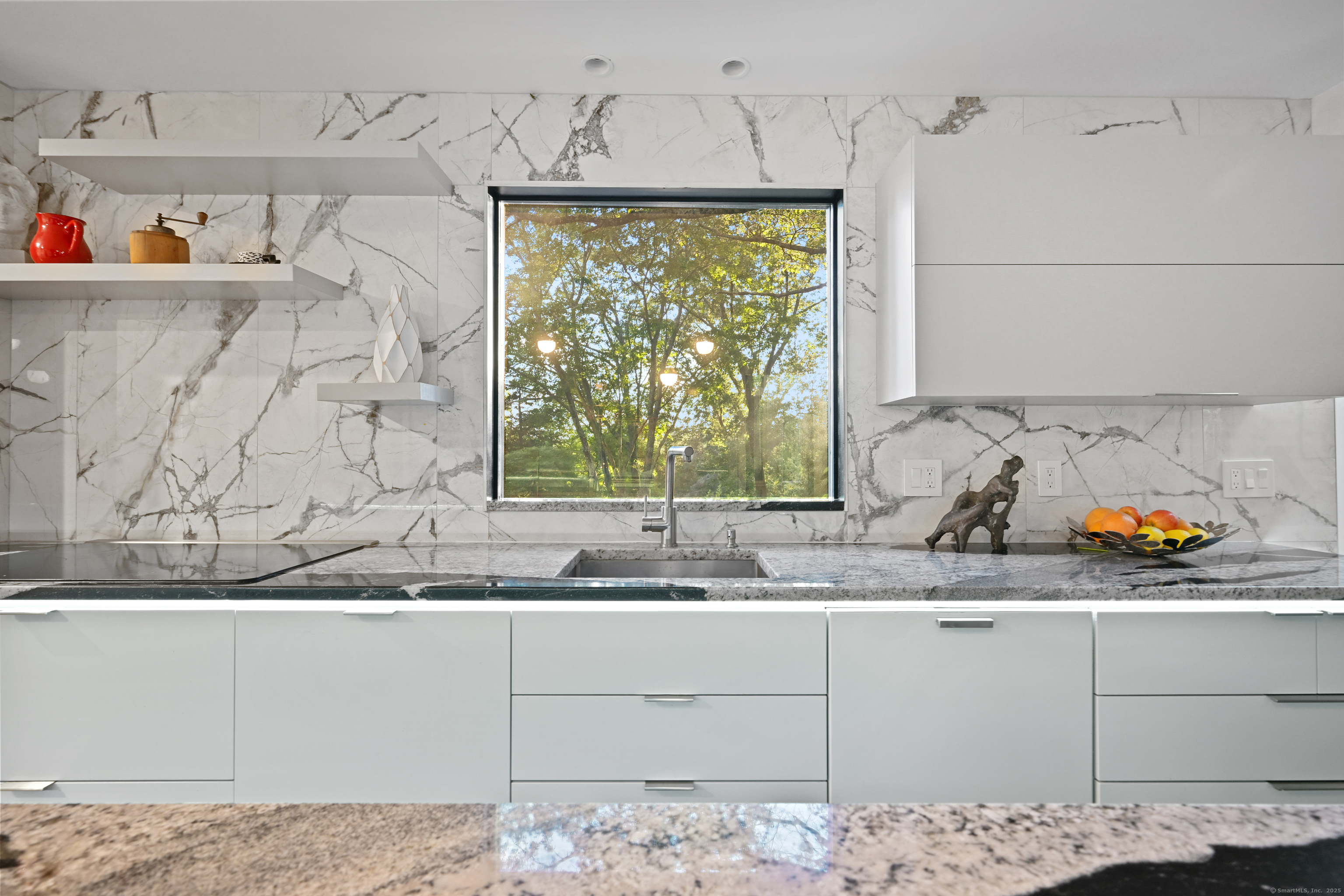 61 Marchant Road Redding, CT 06896 - Photo 8 of 38 a view of a window in a kitchen