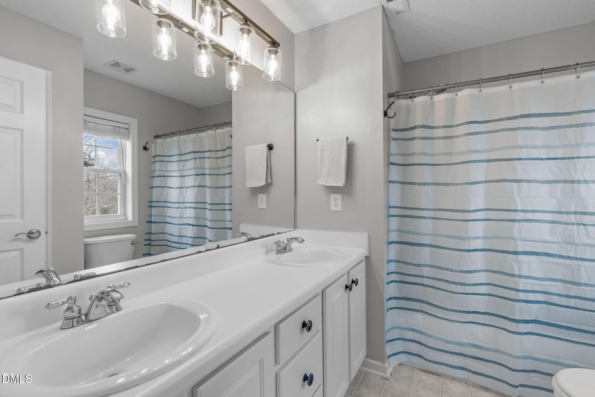 2501 Springfield Park Drive Raleigh, NC 27614 - Photo 34 of 44 a bathroom with a sink and a mirror
