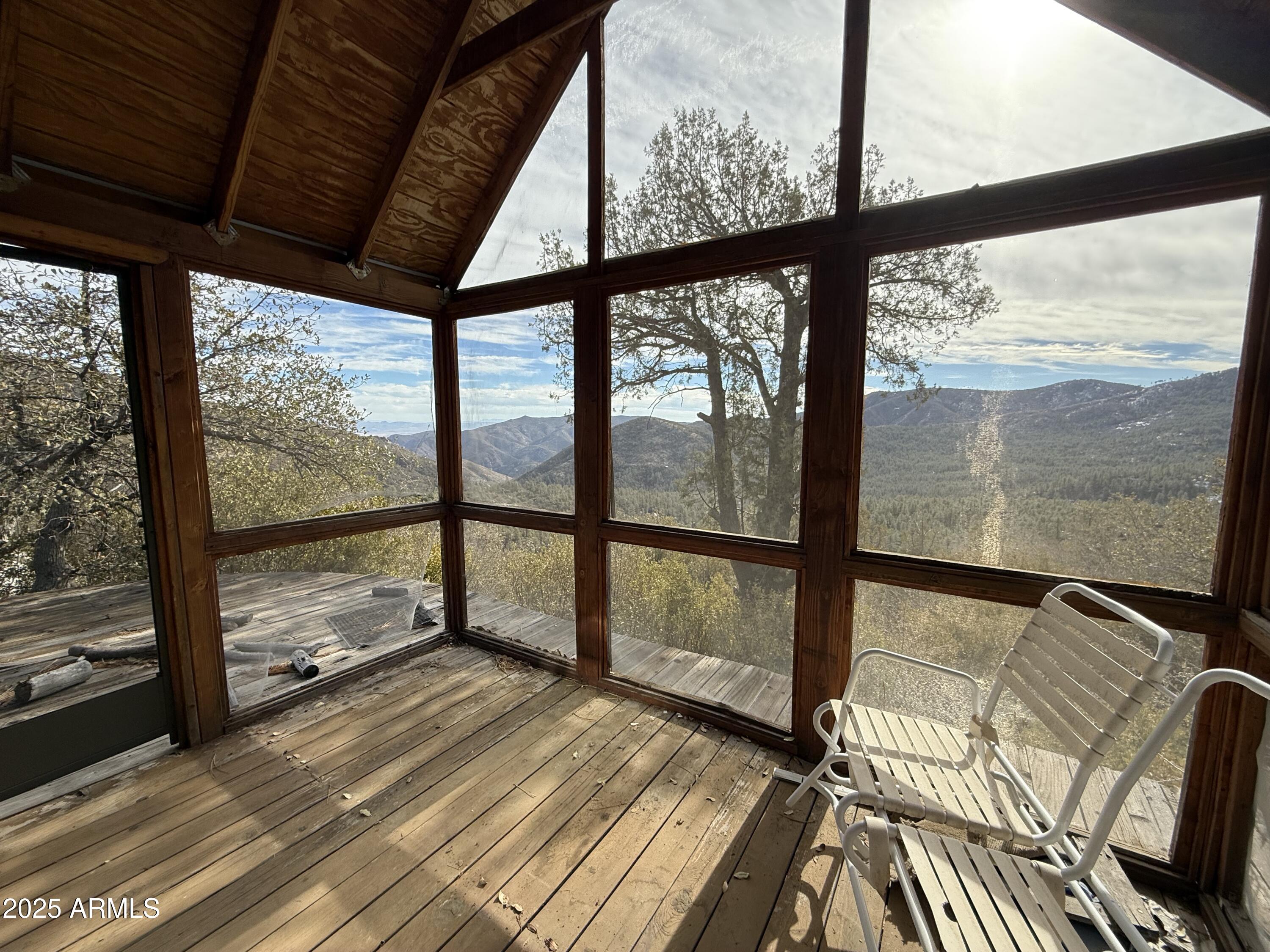 6358 Mountain View Road Crown King, AZ 86343 - Photo 18 of 42 a view of a room with wooden floor