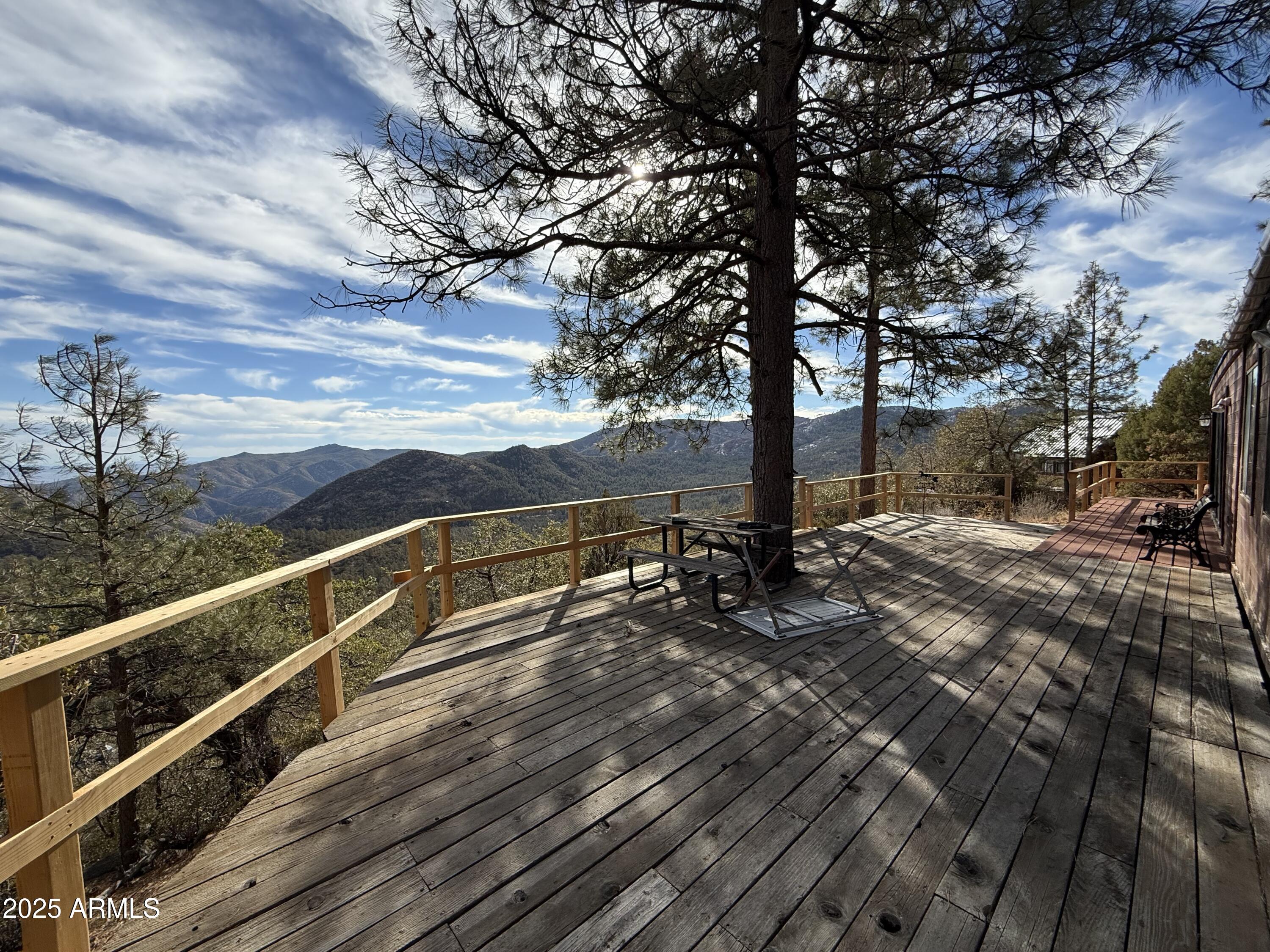 6358 Mountain View Road Crown King, AZ 86343 - Photo 20 of 42 a view of a terrace with a bench