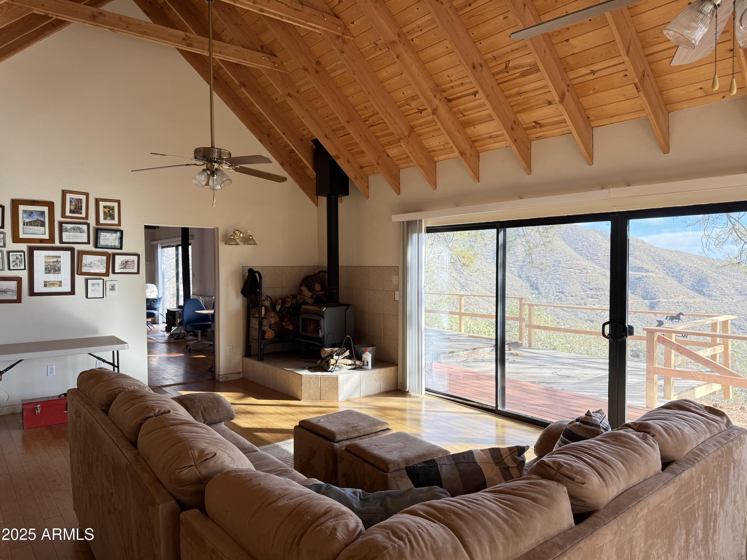 6358 Mountain View Road Crown King, AZ 86343 - Photo 24 of 42 a living room with furniture and a large window